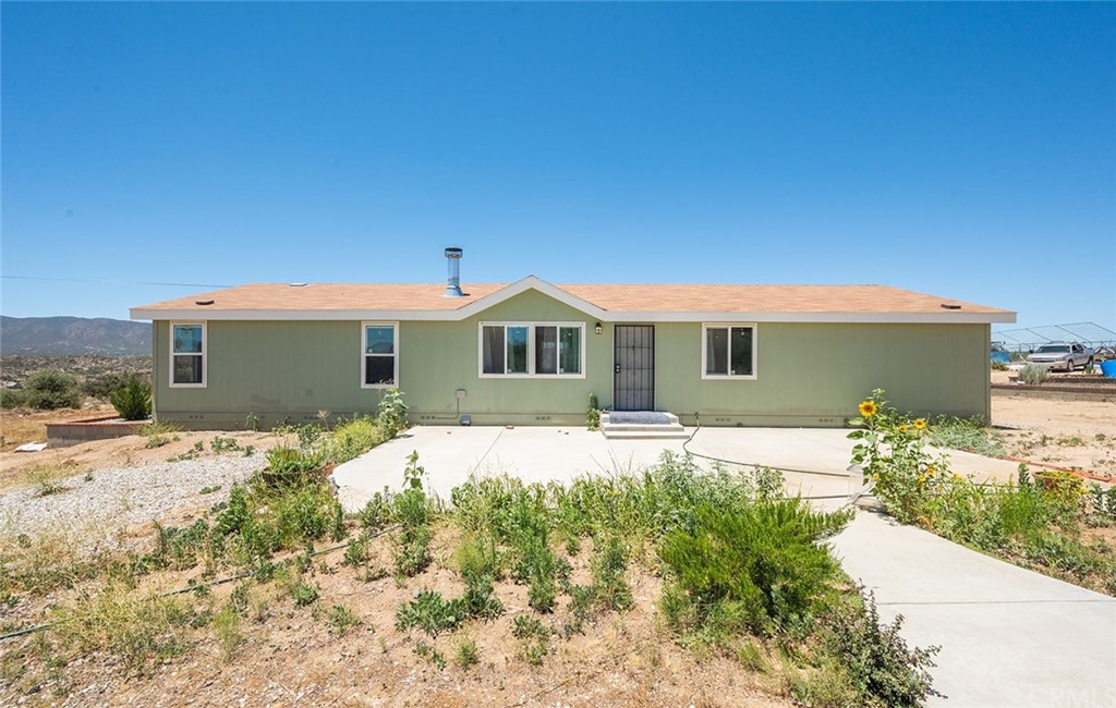 42945 Yucca Valley Road Anza, CA 92539 - Photo 1 of 1 a front view of a house with a yard
