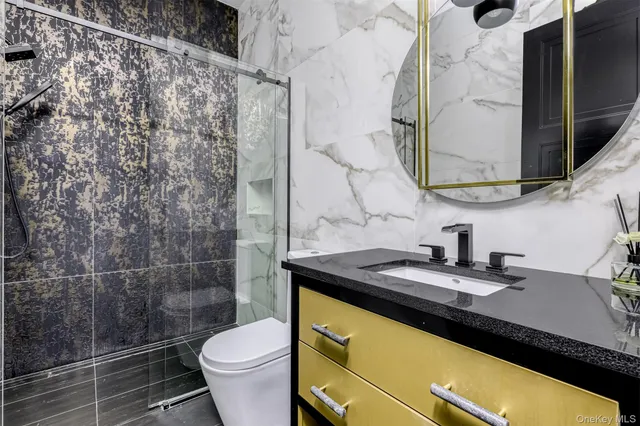 a spacious bedroom with a bed and a flat screen tv