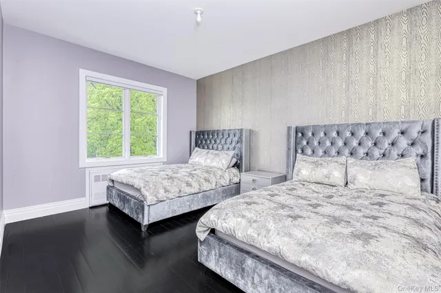 a bedroom with bed and window