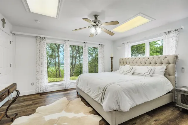 a bedroom with a bed and a chandelier