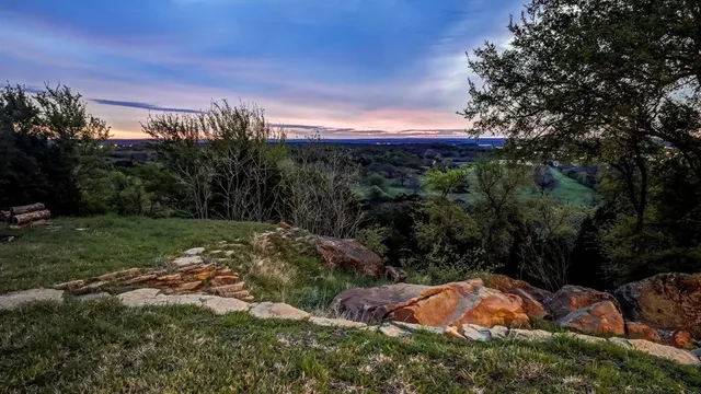 a view of a yard with porch and trees