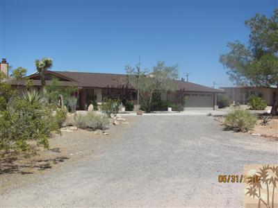 8526 Old Vine Road Joshua Tree, CA 92252 - Photo 1 of 19 a view of a street with a houses