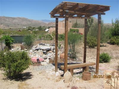 8526 Old Vine Road Joshua Tree, CA 92252 - Photo 7 of 19 a view of a wooden deck with a lake view