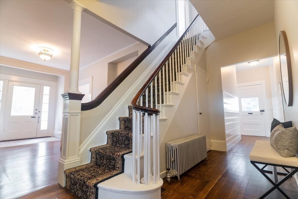 132 Church Street, Unit 1 Waltham, MA 02452 - Photo 15 of 42 a view of entryway and hall with wooden floor