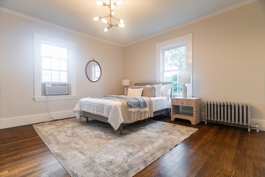 132 Church Street, Unit 1 Waltham, MA 02452 - Photo 16 of 42 a bedroom with a bed and window