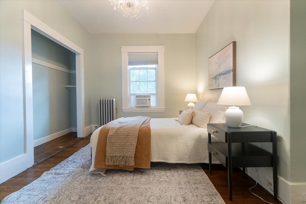 132 Church Street, Unit 1 Waltham, MA 02452 - Photo 26 of 42 a bedroom with a bed and a window