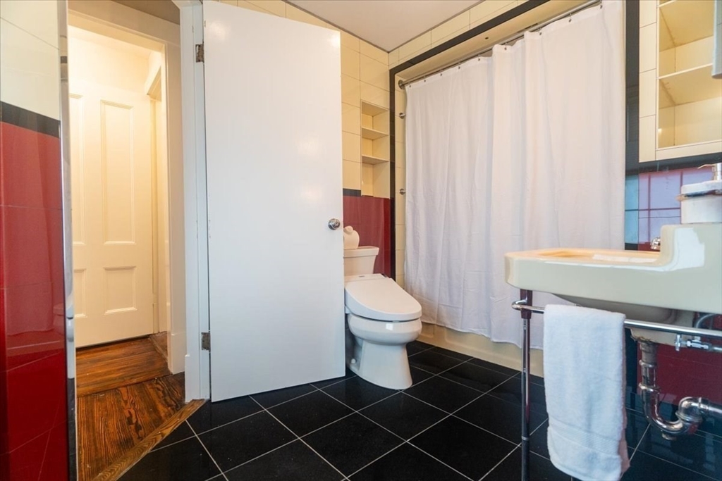 132 Church Street, Unit 1 Waltham, MA 02452 - Photo 28 of 42 a bathroom with a sink toilet and shower