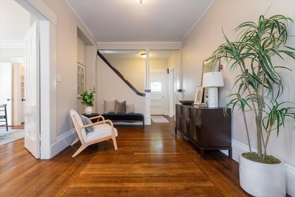 132 Church Street, Unit 1 Waltham, MA 02452 - Photo 3 of 42 a living room with furniture and a potted plant
