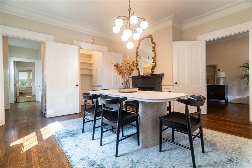 132 Church Street, Unit 1 Waltham, MA 02452 - Photo 4 of 42 a view of a dining room with furniture and wooden floor