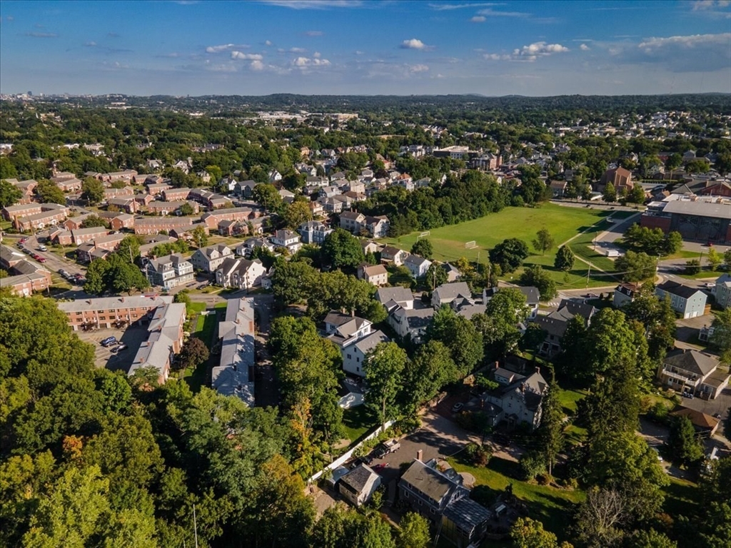 132 Church Street, Unit 1 Waltham, MA 02452 - Photo 41 of 42 an aerial view of residential houses with outdoor space and trees
