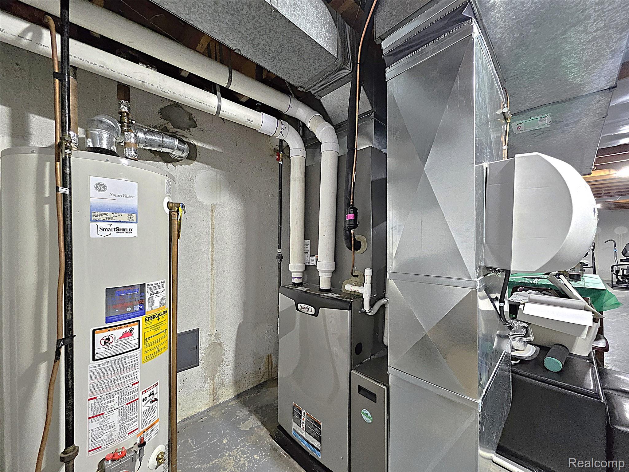 1114 Chaffer Drive Rochester, MI 48306 - Photo 47 of 50 Utility area featuring a water heater, furnace, and extensive ductwork