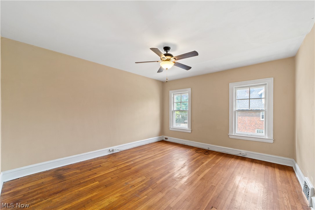 3076 Yorkshire Road Cleveland, OH 44118 - Photo 18 of 47 Unfurnished room featuring hardwood / wood-style flooring and ceiling fan