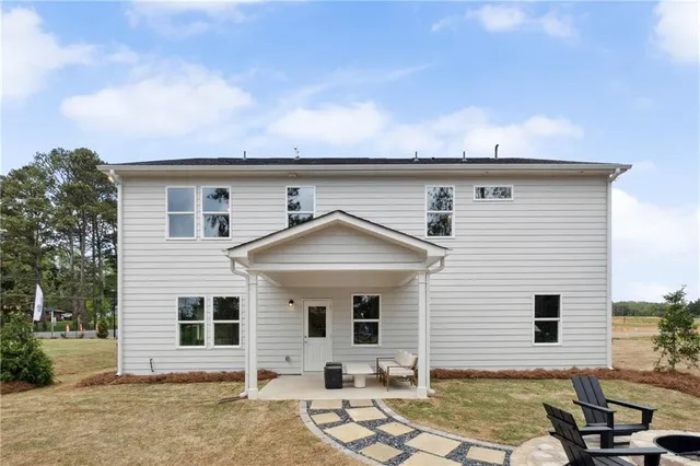 a front view of a house with yard