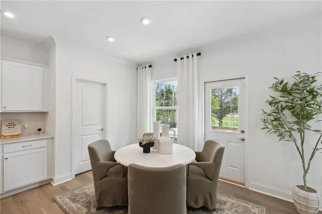 a view of a dining room with furniture window and outside view