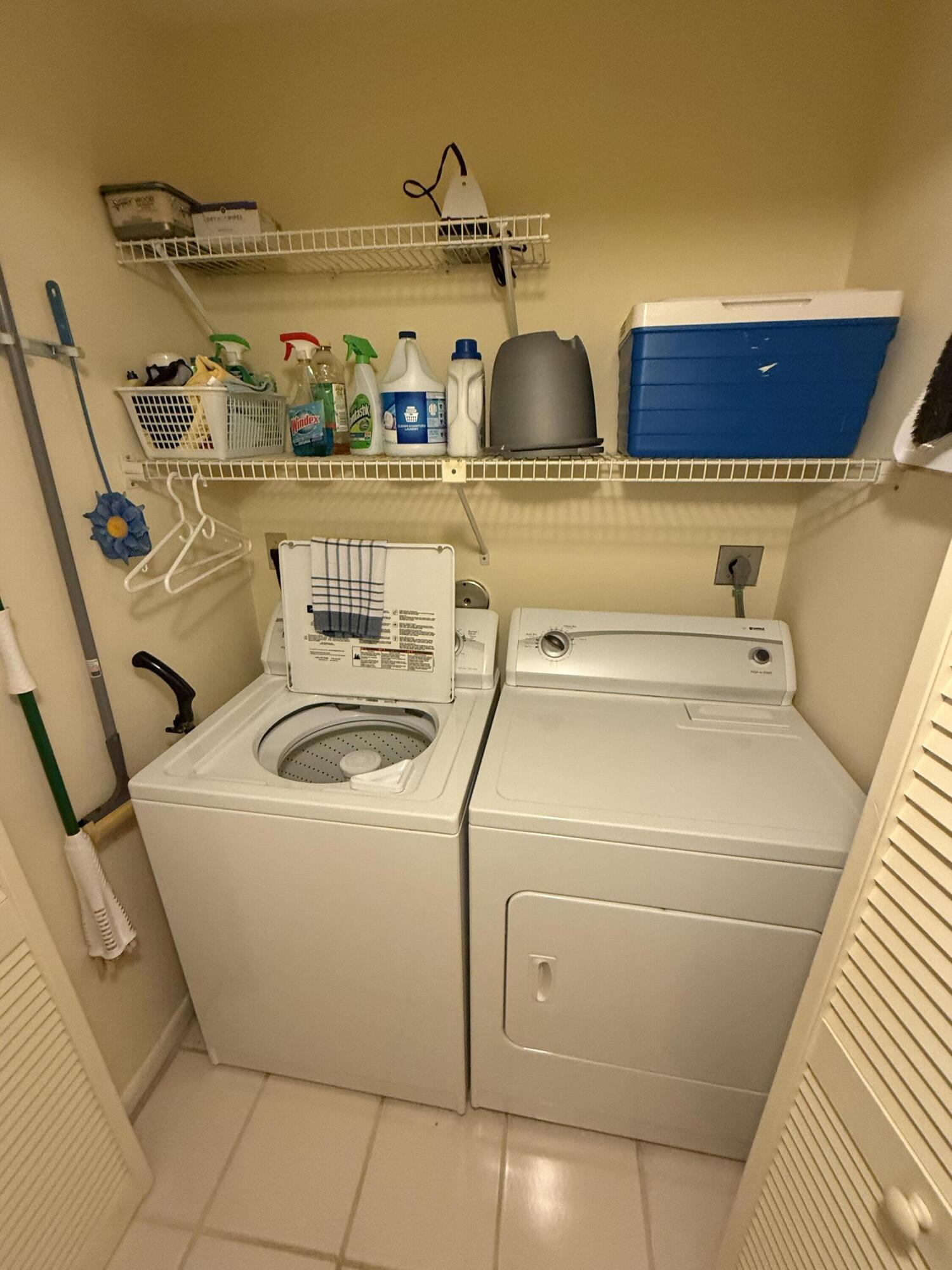 147 Deer Creek Boulevard, Unit 402 Deerfield Beach, FL 33442 - Photo 24 of 81 a utility room with dryer and washer