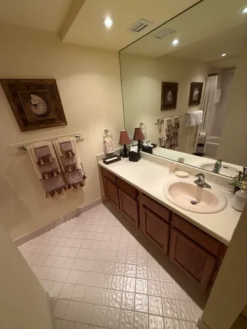 a view of a swimming pool with a yard and plants