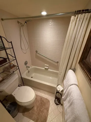 a view of a car park in front of house