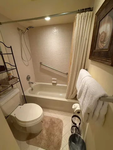 a view of a house with a small yard and plants