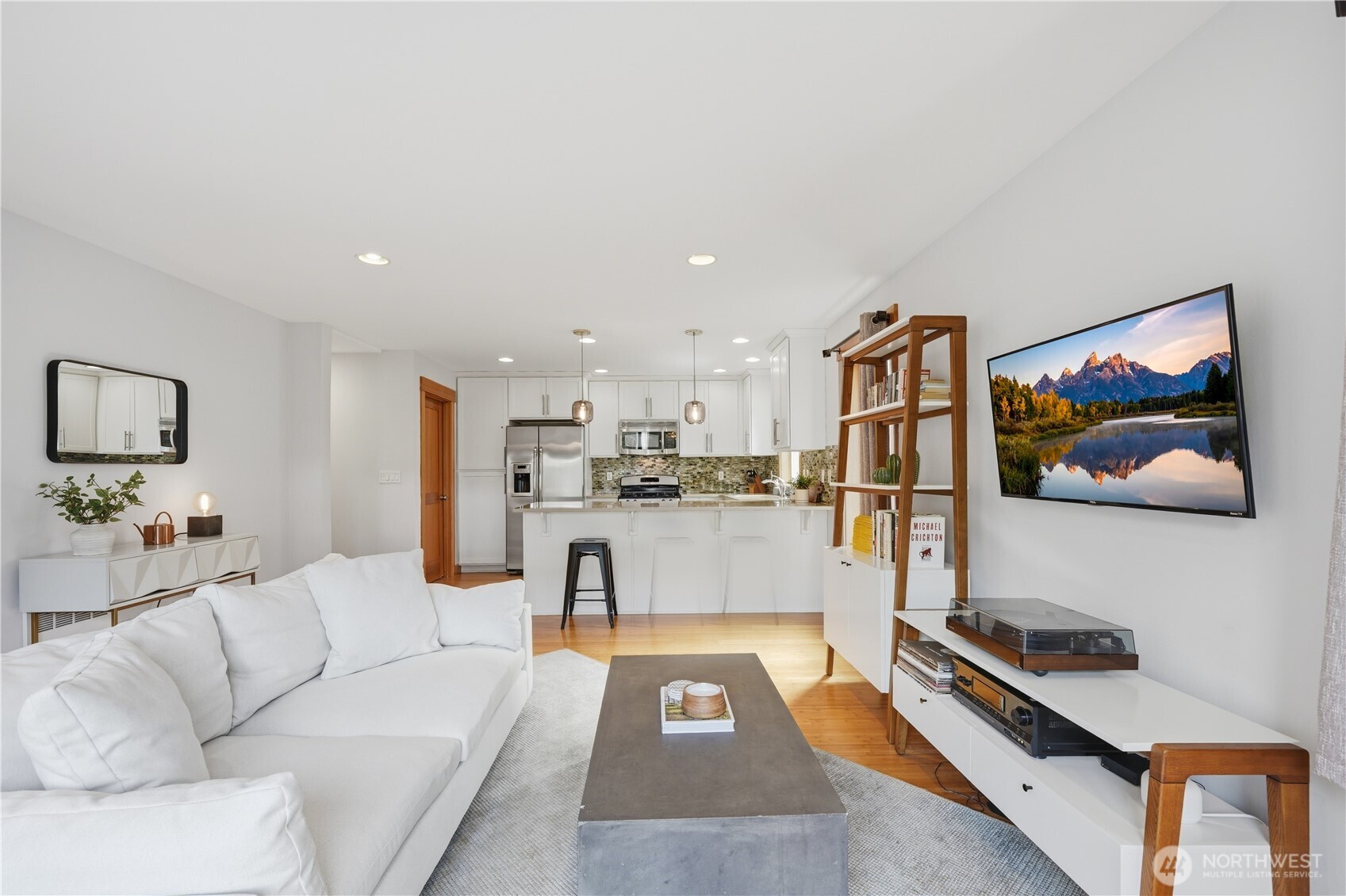 4037 7th Avenue Northeast, Unit A Seattle, WA 98105 - Photo 12 of 35 a living room with furniture and kitchen view