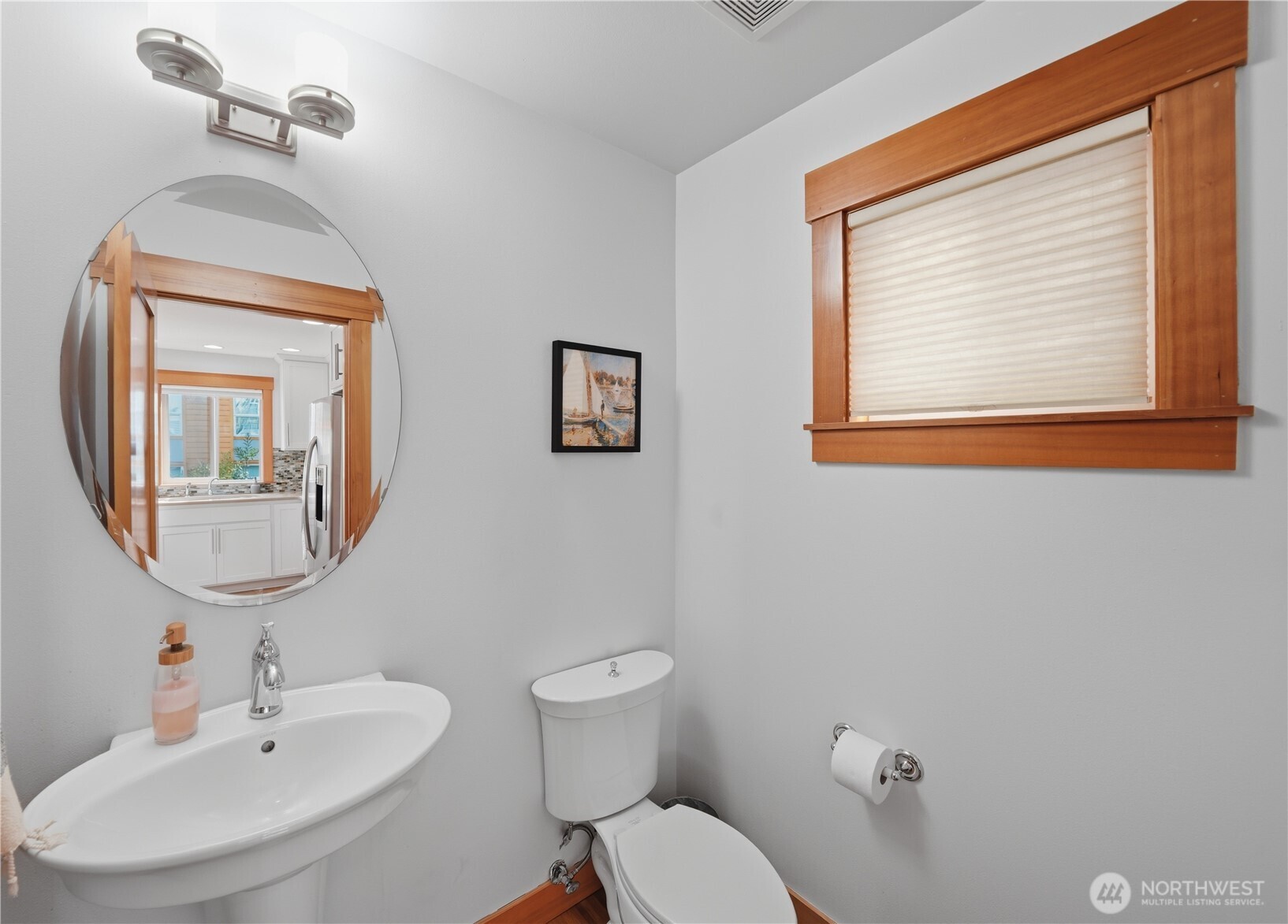 4037 7th Avenue Northeast, Unit A Seattle, WA 98105 - Photo 18 of 35 a bathroom with a toilet a sink and mirror