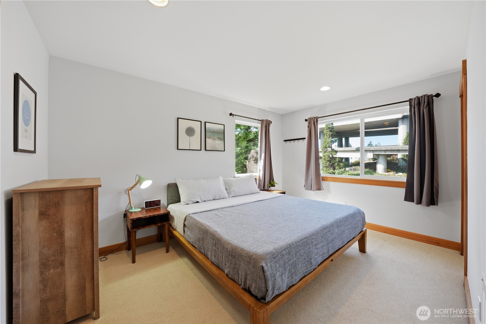 4037 7th Avenue Northeast, Unit A Seattle, WA 98105 - Photo 22 of 35 a bedroom with a bed and a window