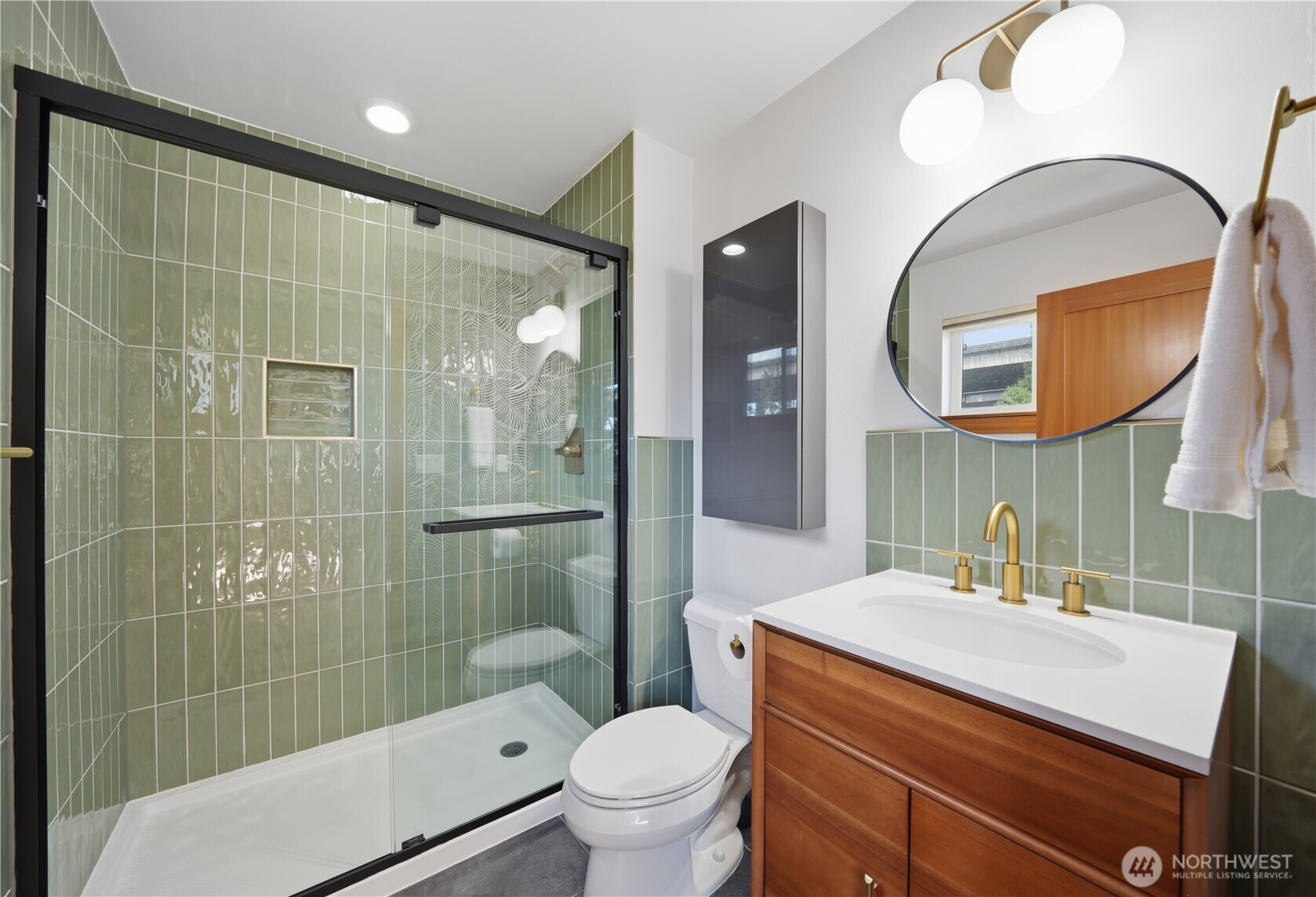 4037 7th Avenue Northeast, Unit A Seattle, WA 98105 - Photo 24 of 35 a bathroom with a sink toilet and shower