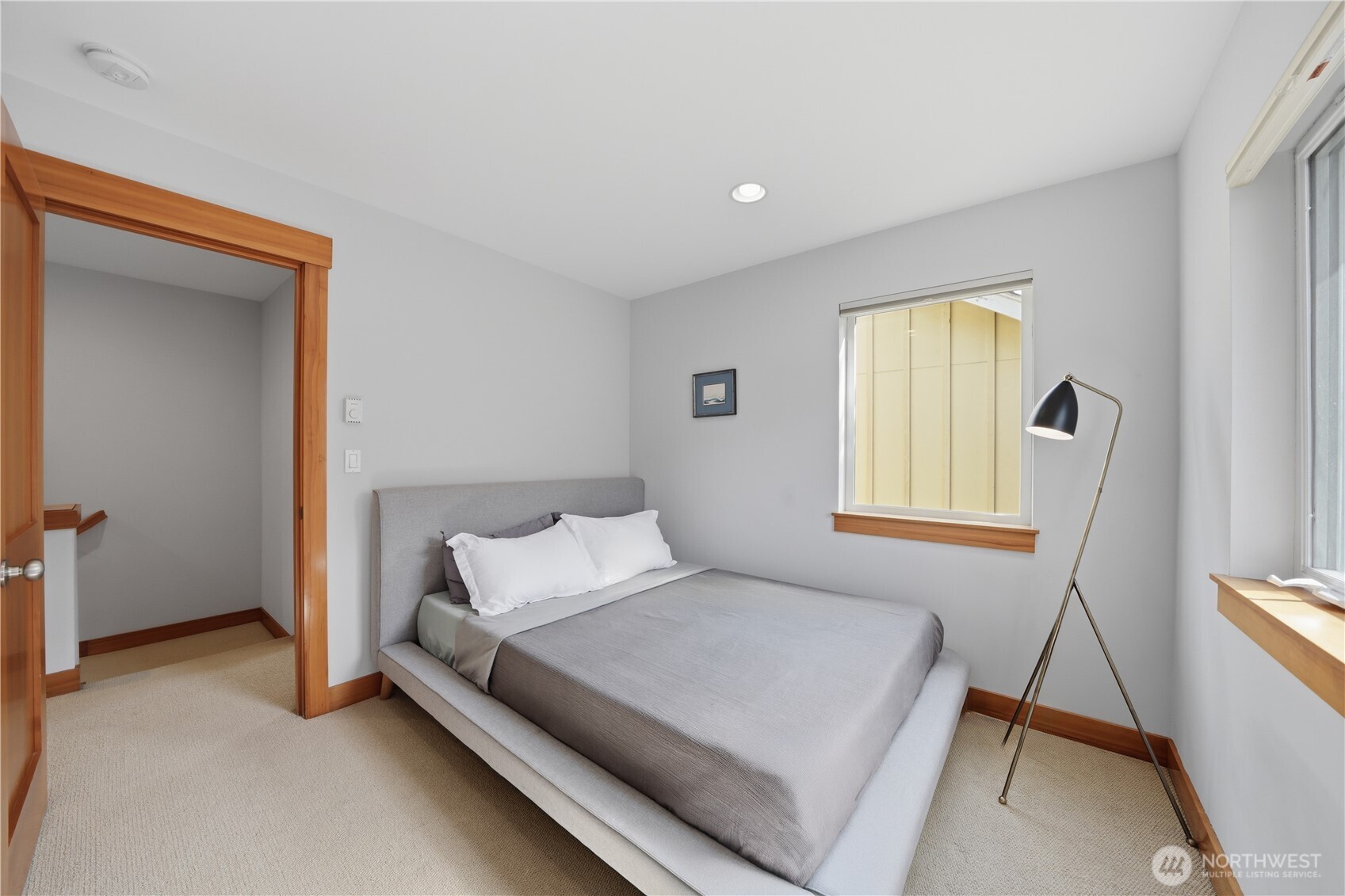 4037 7th Avenue Northeast, Unit A Seattle, WA 98105 - Photo 25 of 35 a bed room with a bed and a window