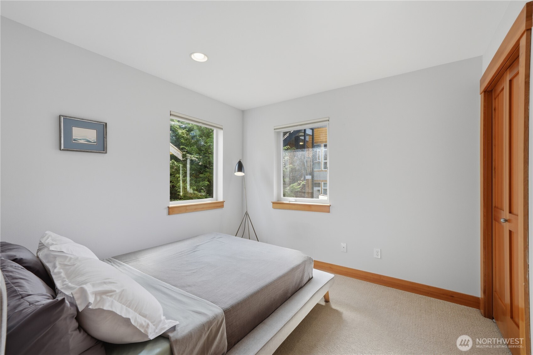 4037 7th Avenue Northeast, Unit A Seattle, WA 98105 - Photo 26 of 35 a bedroom with a bed and a window