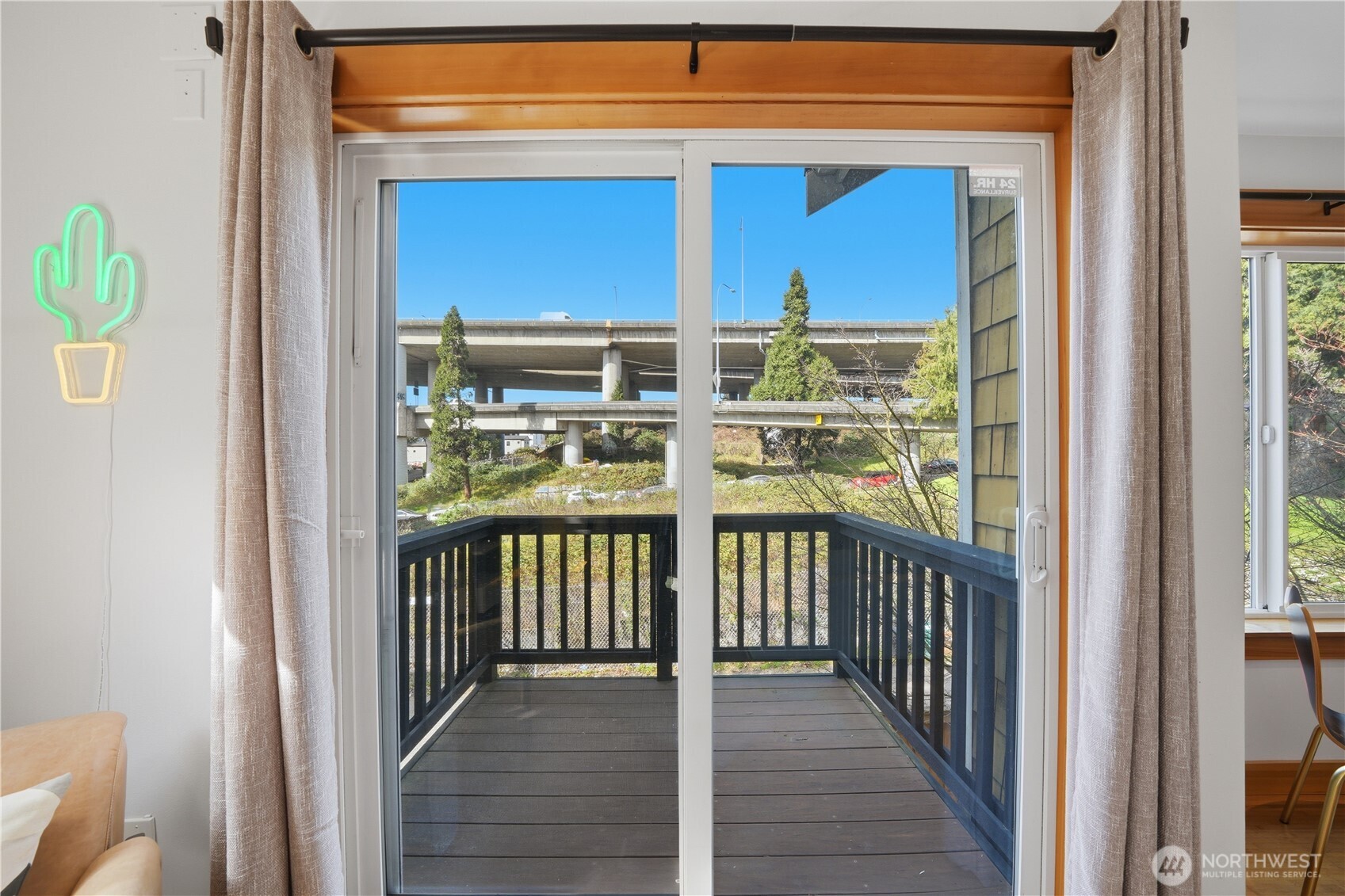 4037 7th Avenue Northeast, Unit A Seattle, WA 98105 - Photo 10 of 35 a view of a balcony with wooden floor