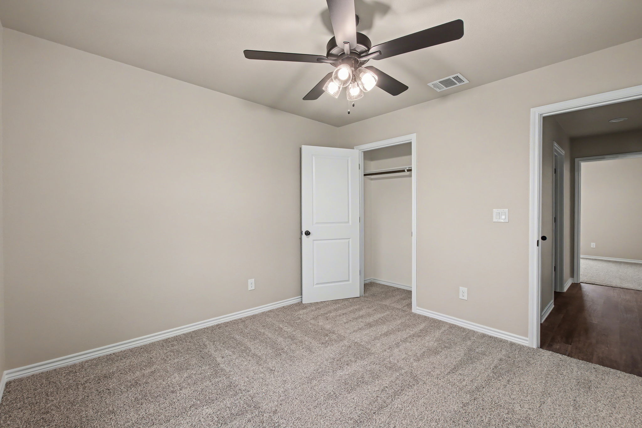 206 Water Wl Road Burnet, TX 78611 - Photo 16 of 25 Plush carpeting anchors this versatile secondary bedroom complete with a functional closet.