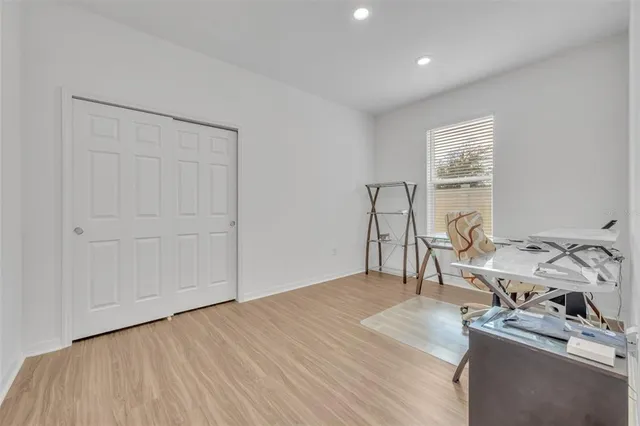 a room with a bed and a table in it