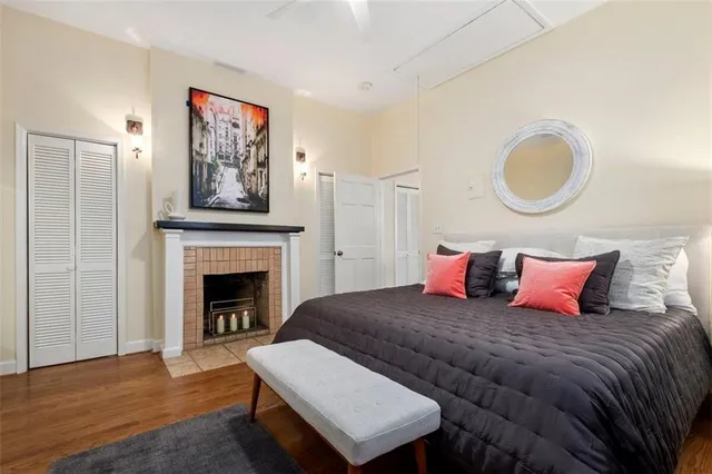 a bedroom with a bed and a television