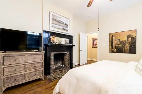 a bedroom with a bed and a television