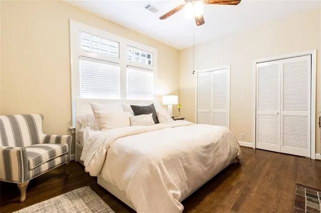 a bedroom with a bed and a table in it