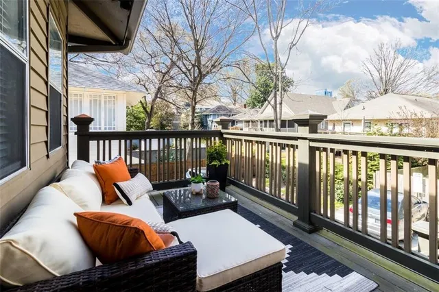 a view of a chairs and table in the balcony