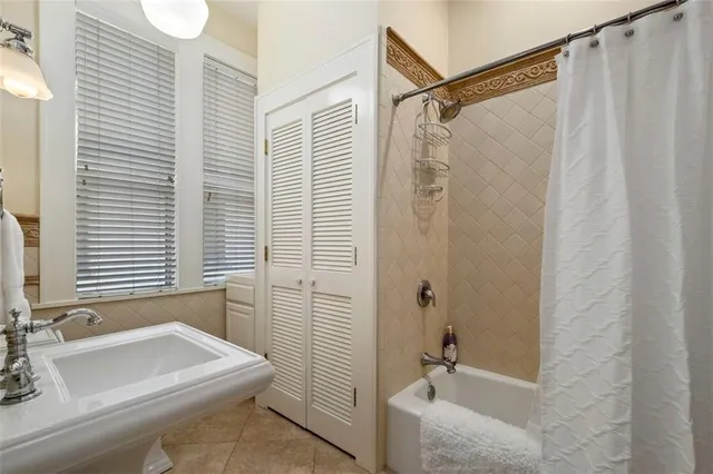 a bedroom with a bed and a fireplace