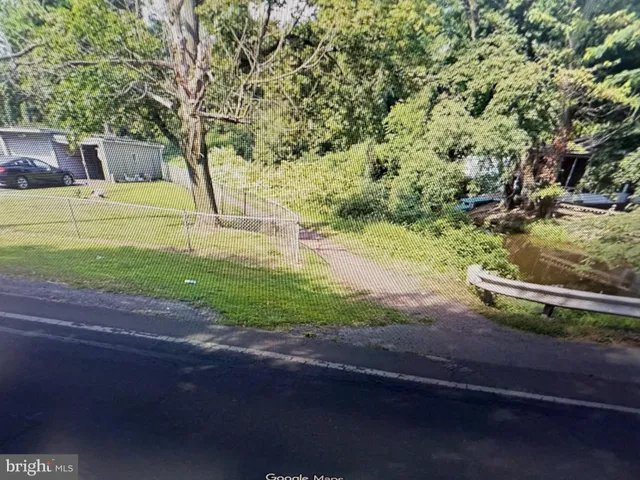 a view of a yard with an outdoor space