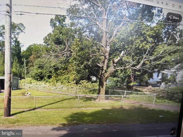 a view of a yard with an trees