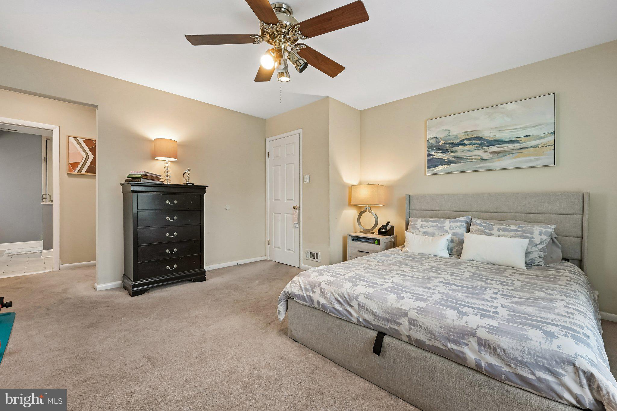 11 Old Mill Road Sewell, NJ 08080 - Photo 17 of 25 a bedroom with a bed and a painting on the wall