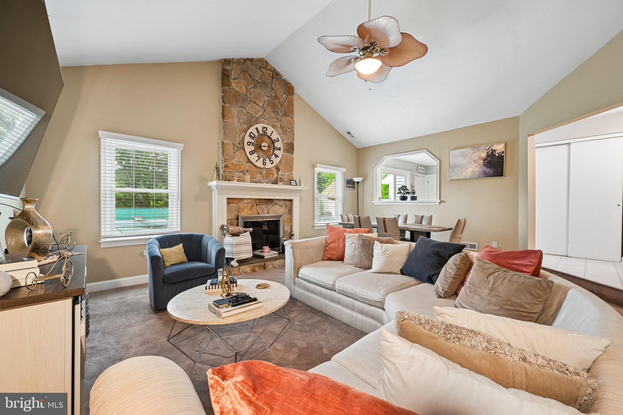 11 Old Mill Road Sewell, NJ 08080 - Photo 4 of 25 a living room with furniture a fireplace and a large window