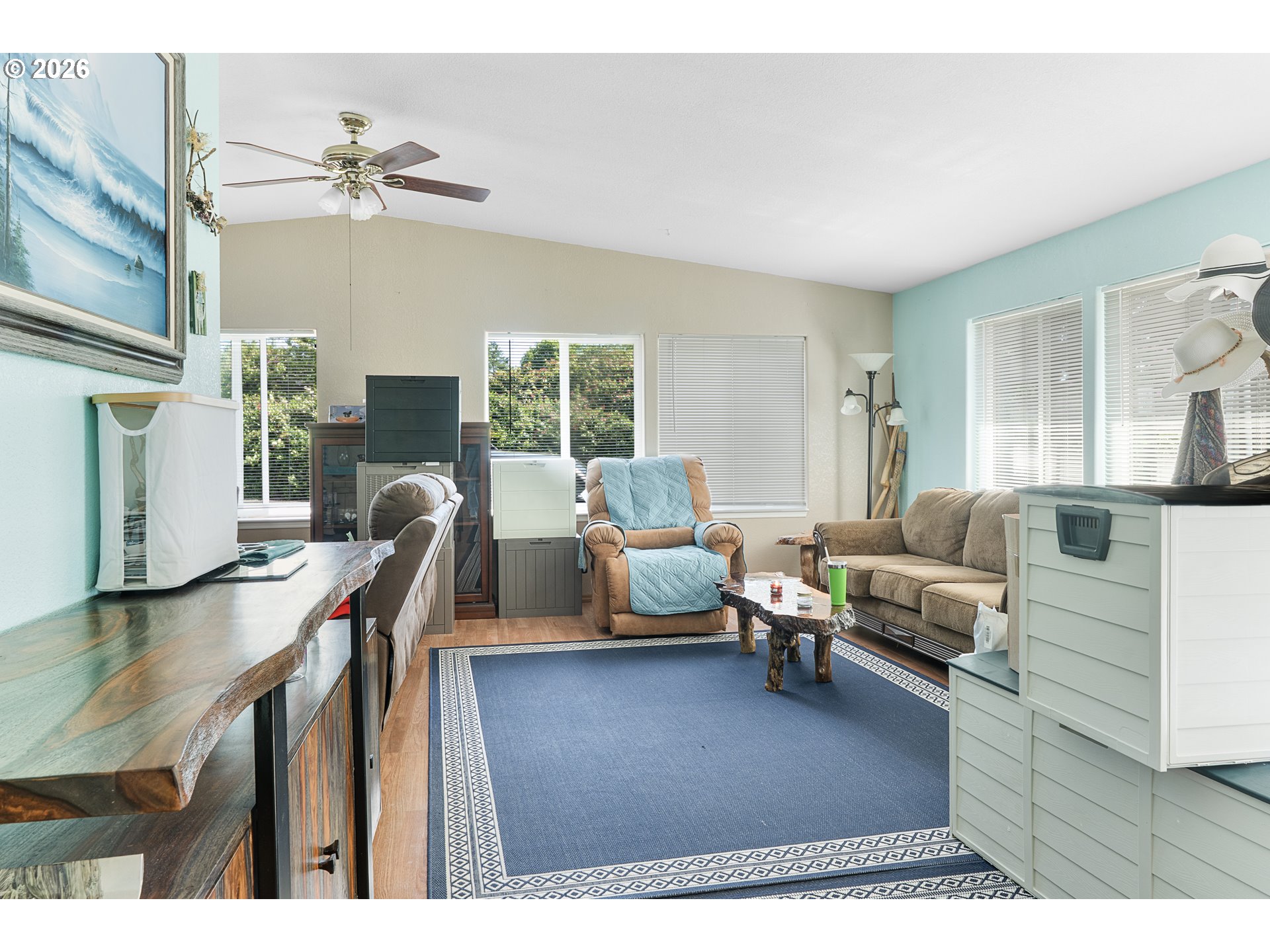 96465 Coverdell Road, Unit 8 Brookings, OR 97415 - Photo 10 of 16 a living room with furniture and a flat screen tv