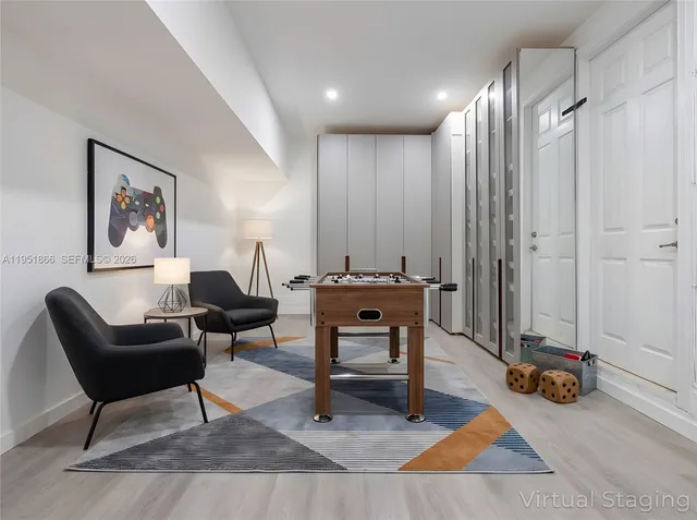 a living room with furniture a rug and a table