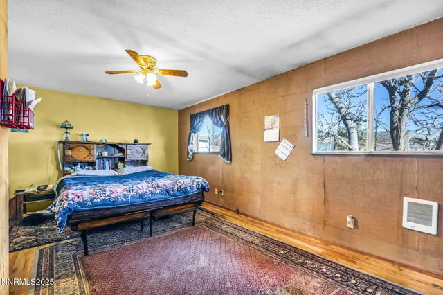a view of a patio with table and chairs with wooden floor and fence