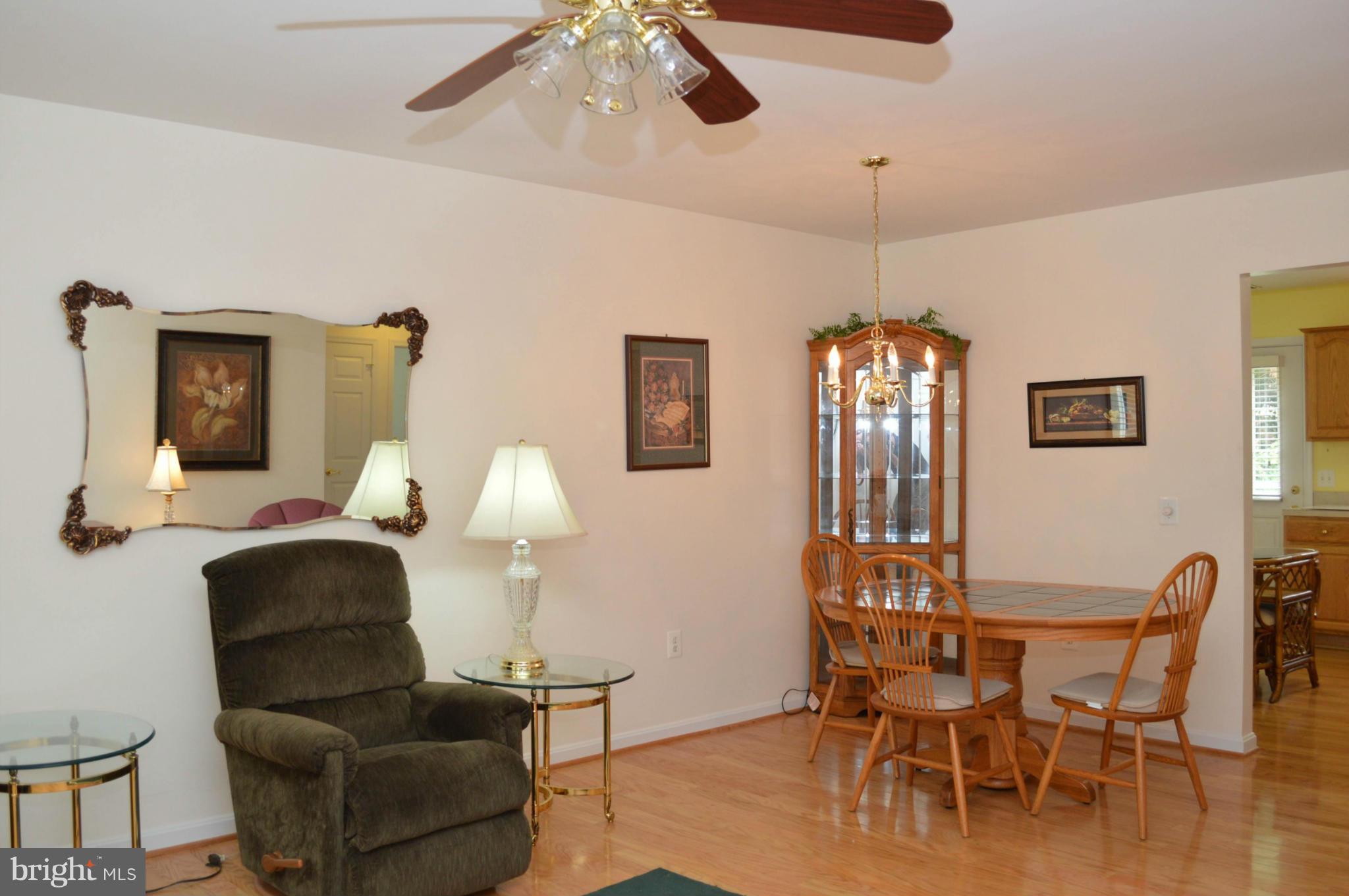 703 Merry Go Round Way Mount Airy, MD 21771 - Photo 2 of 27 a dining room with furniture and wooden floor