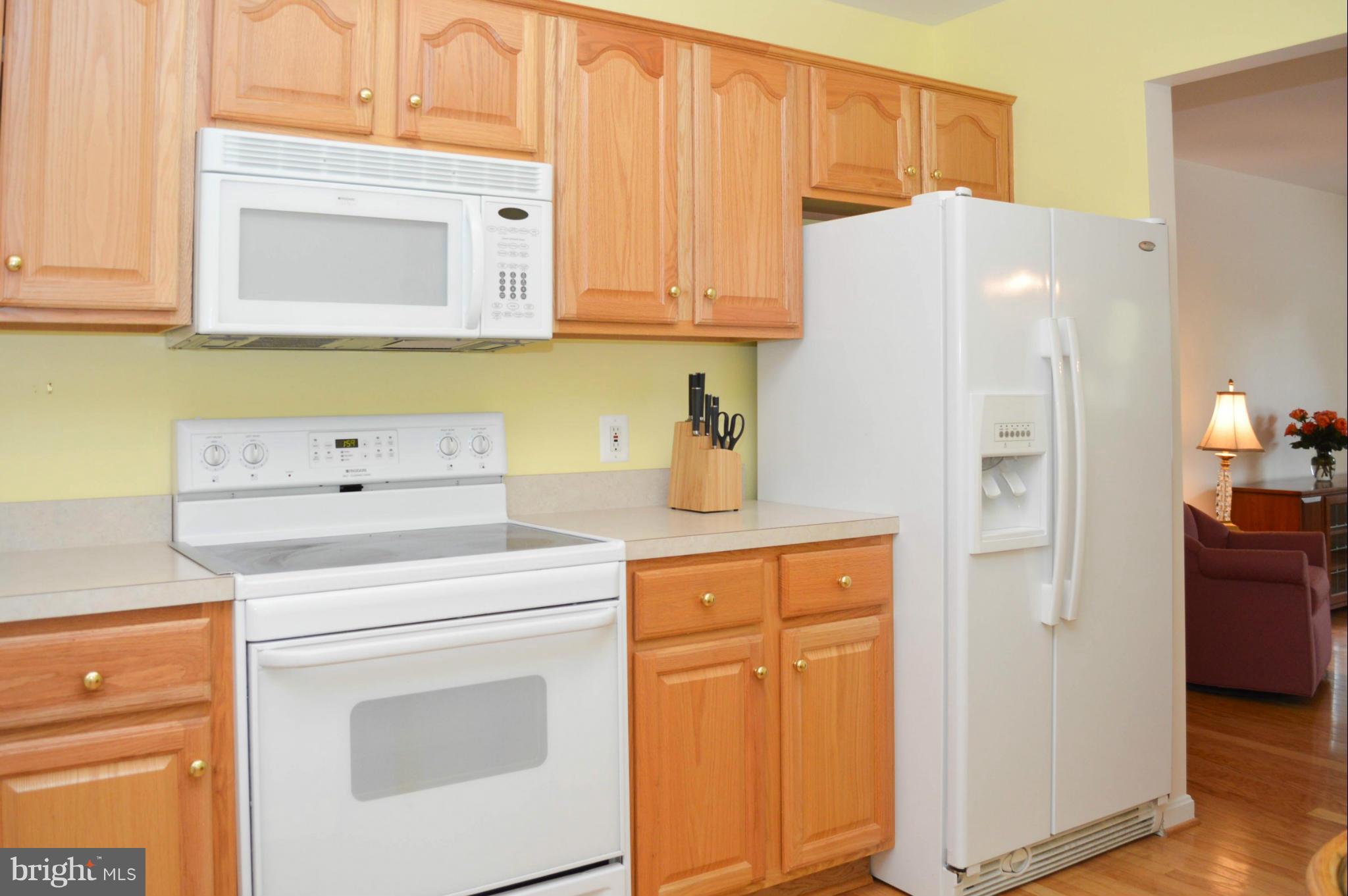 703 Merry Go Round Way Mount Airy, MD 21771 - Photo 11 of 27 a kitchen with stainless steel appliances white cabinets and a refrigerator