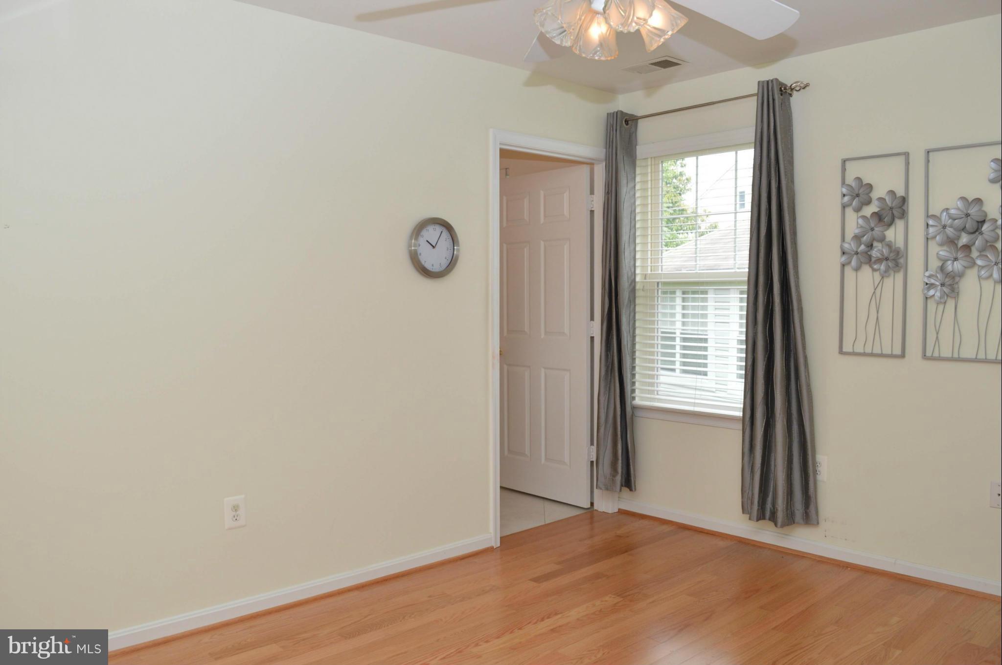 703 Merry Go Round Way Mount Airy, MD 21771 - Photo 13 of 27 an empty room with windows and closet