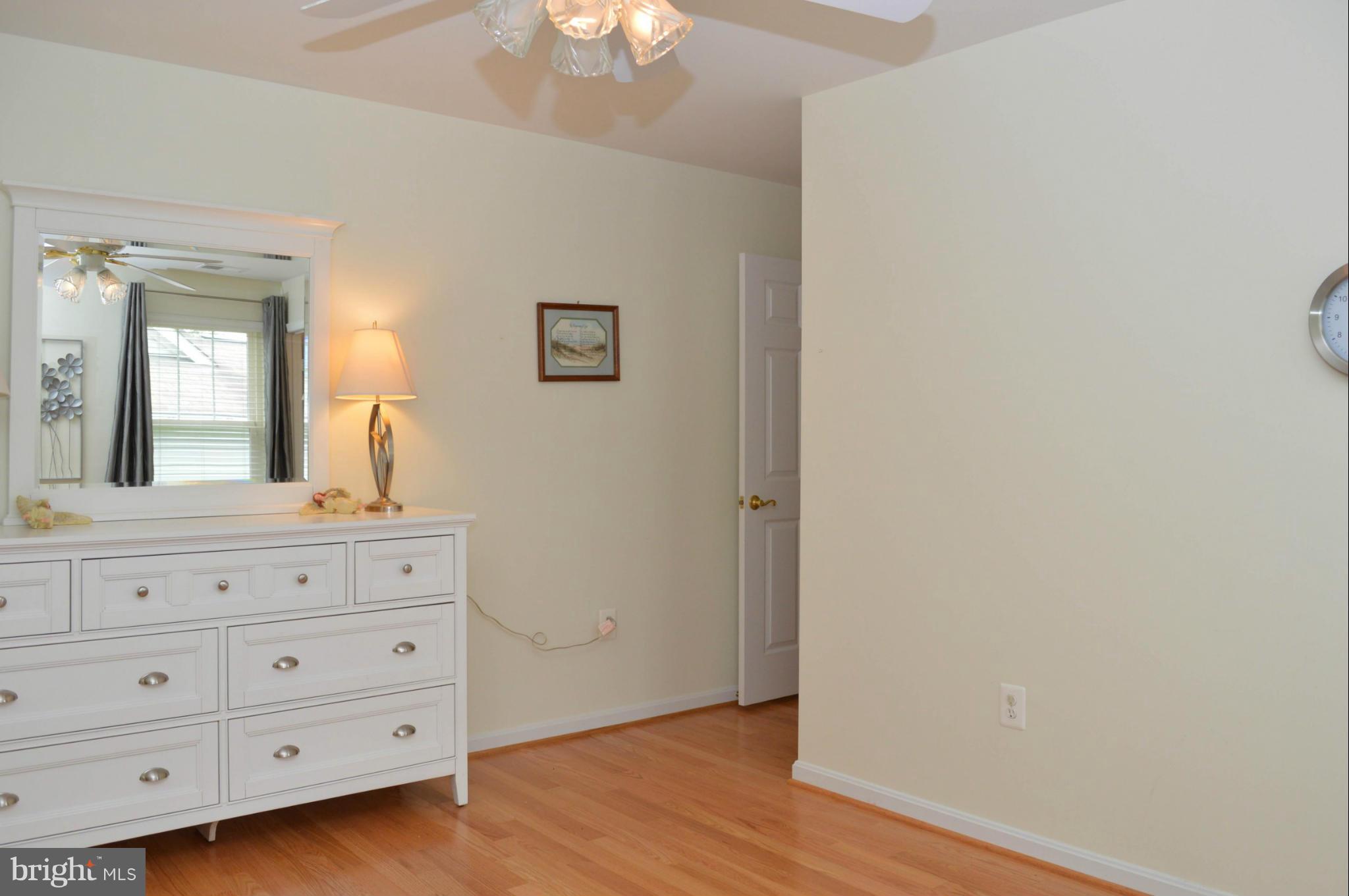 703 Merry Go Round Way Mount Airy, MD 21771 - Photo 15 of 27 a bathroom with a wooden floor a sink and a mirror