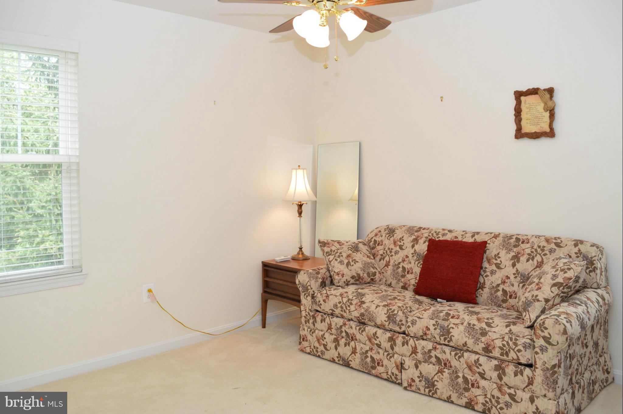 703 Merry Go Round Way Mount Airy, MD 21771 - Photo 16 of 27 a bed sitting in a bedroom next to a window