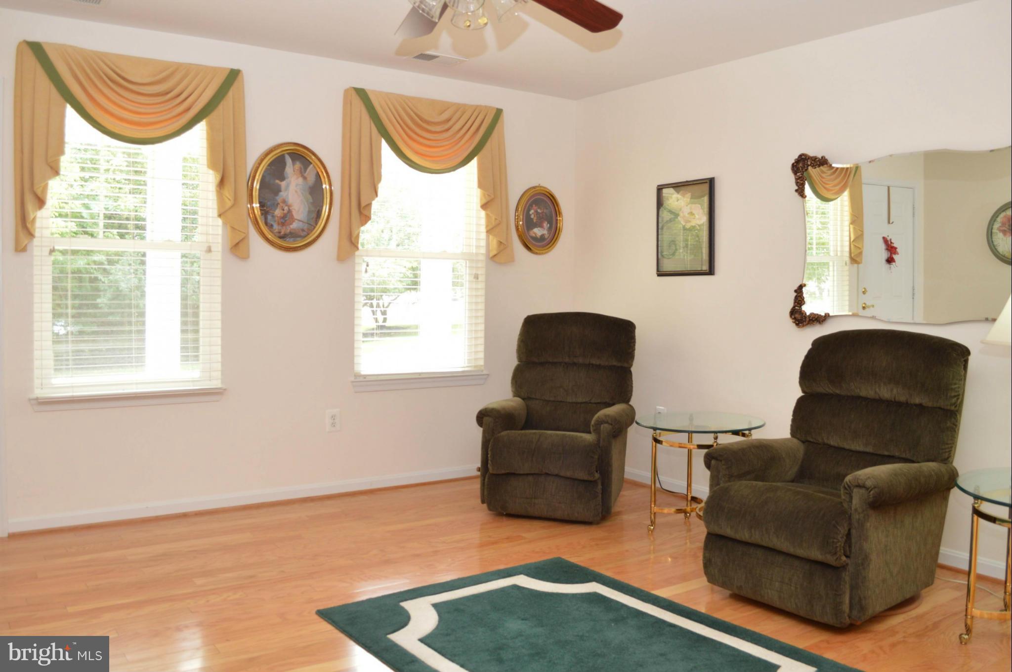 703 Merry Go Round Way Mount Airy, MD 21771 - Photo 3 of 27 a living room with furniture and a window