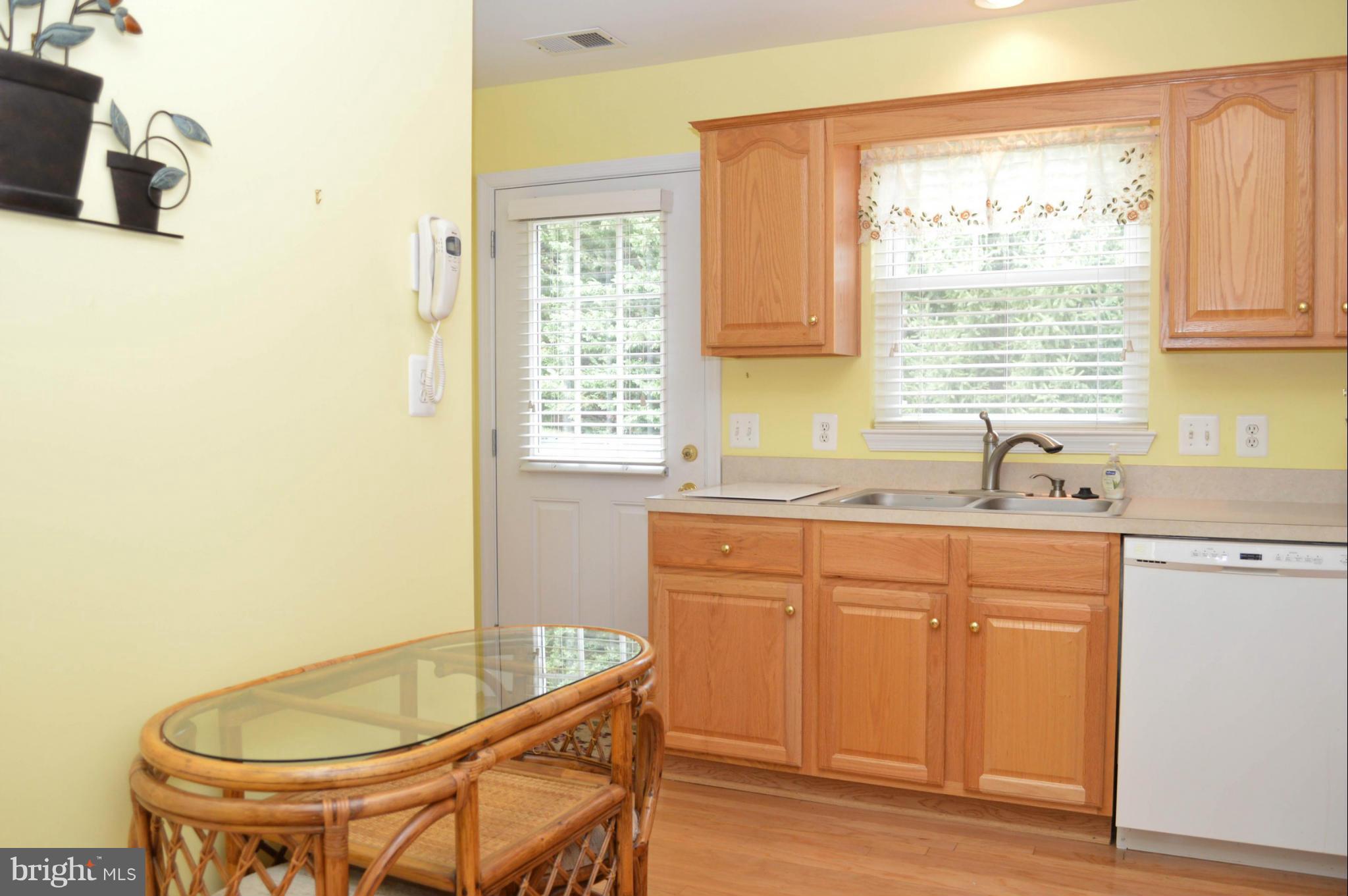 703 Merry Go Round Way Mount Airy, MD 21771 - Photo 7 of 27 a kitchen with a sink and a window